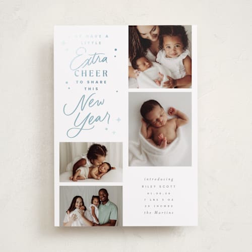 This is a frozen lake babys first christmas with foil pressed by Everett Paper Goods called extra cheerful printing on recycled smooth signature in standard