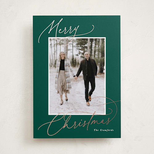 This is a pine foil pressed holiday cards with foil pressed by Hooray Creative called christmas script printing on recycled smooth signature in standard