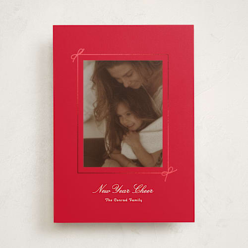 This is a poinsettia foil pressed holiday cards with foil pressed by Baumbirdy called delicate bow printing on recycled smooth signature in standard