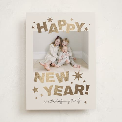 This is a champagne foil pressed holiday cards with foil pressed by Kercia Jane called big year energy printing on recycled smooth signature in standard