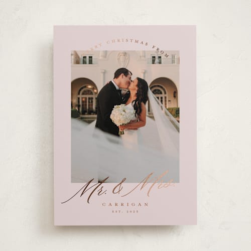This is a dusty rose foil pressed holiday cards with foil pressed by Pink House Press called mr. and mrs. printing on recycled smooth signature in standard