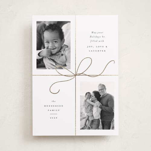 This is a snow foil pressed holiday cards with foil pressed by Emily Betts called bow two printing on recycled smooth signature in standard