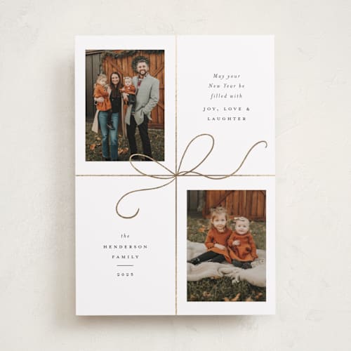 This is a snow foil pressed holiday cards with foil pressed by Emily Betts called bow two printing on recycled smooth signature in standard