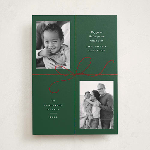 This is a holly foil pressed holiday cards with foil pressed by Emily Betts called bow two printing on recycled smooth signature in standard