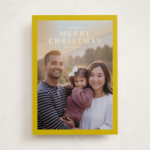 This is a mustard foil pressed holiday cards with foil pressed by Chris Griffith called a sentimental holiday printing on recycled smooth signature in standard