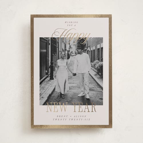 This is a cream foil pressed holiday cards with foil pressed by Megan Cash called scripted frame printing on recycled smooth signature in standard