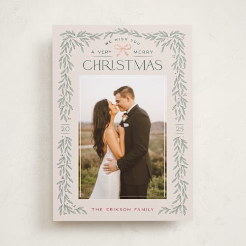 This is a ecru foil pressed holiday cards with foil pressed by Hooray Creative called christmas garland printing on recycled smooth signature in standard