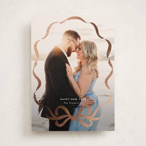 This is a mist foil pressed holiday cards with foil pressed by Jackie Crawford called rustic bow printing on recycled smooth signature in standard