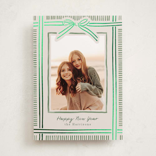 This is a moss foil pressed holiday cards with foil pressed by Chris Griffith called holiday wrap printing on recycled smooth signature in standard