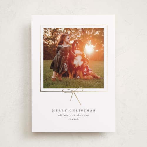 This is a dusk foil pressed holiday cards with foil pressed by Baumbirdy called little bow printing on recycled smooth signature in standard