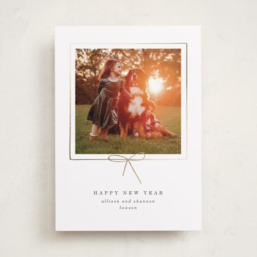 This is a dusk foil pressed holiday cards with foil pressed by Baumbirdy called little bow printing on recycled smooth signature in standard