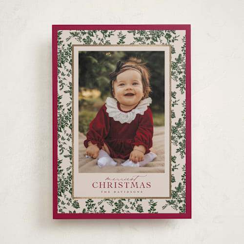 This is a holly berry foil pressed holiday cards with foil pressed by Jenna Holcomb called merry floral toile printing on recycled smooth signature in standard