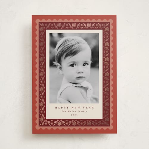 This is a cinnamon foil pressed holiday cards with foil pressed by Olivia Raufman called folkloric printing on recycled smooth signature in standard