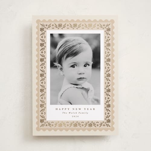 This is a eggnog foil pressed holiday cards with foil pressed by Olivia Raufman called folkloric printing on recycled smooth signature in standard