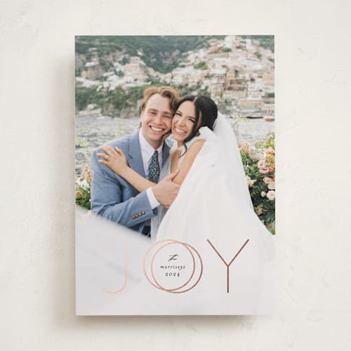 This is a midnight foil pressed holiday cards with foil pressed by Erica Krystek called rings of joy printing on recycled smooth signature in standard