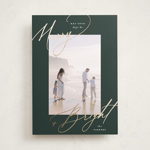 This is a evergreen foil pressed holiday cards with foil pressed by Carolyn Nicks called bright+merry printing on recycled smooth signature in standard