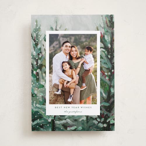This is a pine foil pressed holiday cards with foil pressed by Holly Whitcomb called cozy snowy forest printing on recycled smooth signature in standard