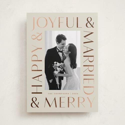 This is a eggnog foil pressed holiday cards with foil pressed by Louise Kay called joyfully married printing on recycled smooth signature in standard