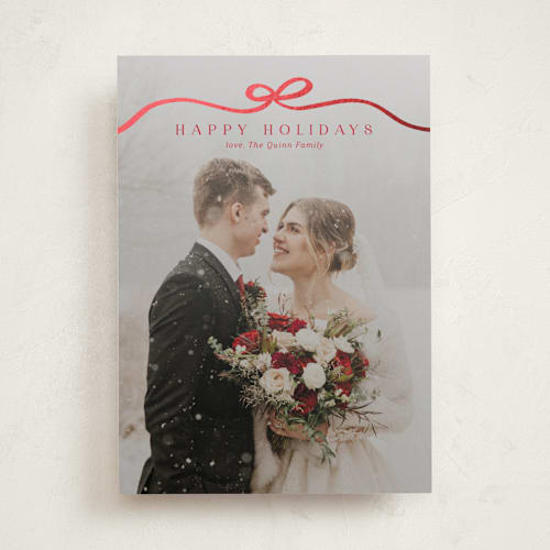 This is a cardinal foil pressed holiday cards with foil pressed by Kaydi Bishop called bow tied printing on recycled smooth signature in standard