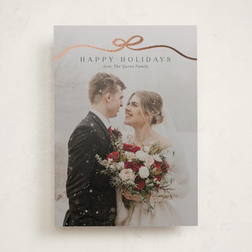 This is a pine foil pressed holiday cards with foil pressed by Kaydi Bishop called bow tied printing on recycled smooth signature in standard