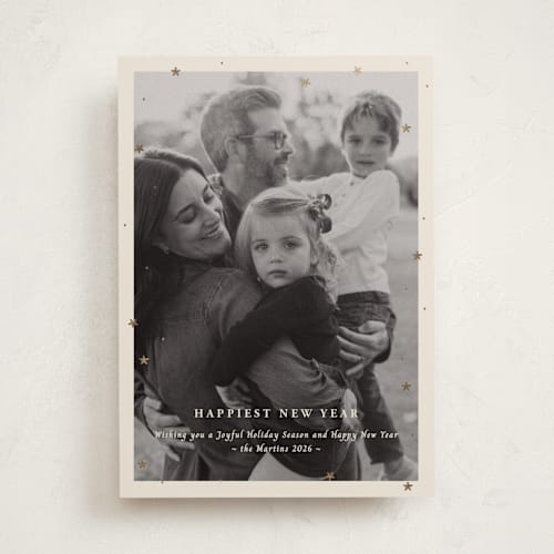 This is a champagne foil pressed holiday cards with foil pressed by Ani Somi called merry little stars printing on recycled smooth signature in standard