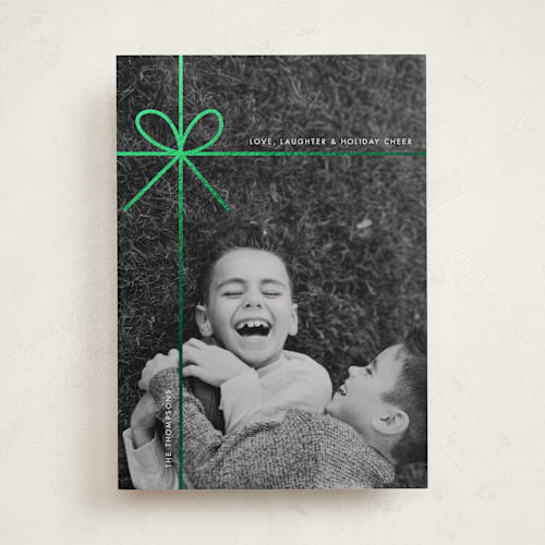 This is a mint foil pressed holiday cards with foil pressed by Joyce Pinheiro called tied in cheer printing on recycled smooth signature in standard