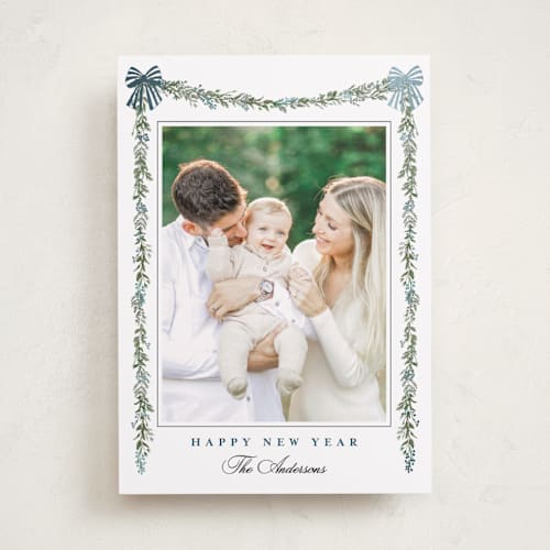 This is a winter berry foil pressed holiday cards with foil pressed by Susan Moyal called holly & bows printing on recycled smooth signature in standard