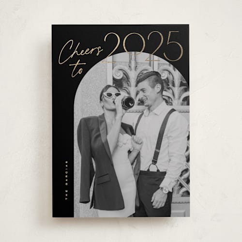 This is a coal foil pressed holiday cards with foil pressed by Creo Study called gilded cheers printing on recycled smooth signature in standard