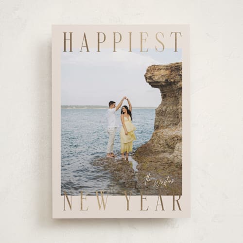 This is a champagne foil pressed holiday cards with foil pressed by Ekko Studio called headlines printing on recycled smooth signature in standard