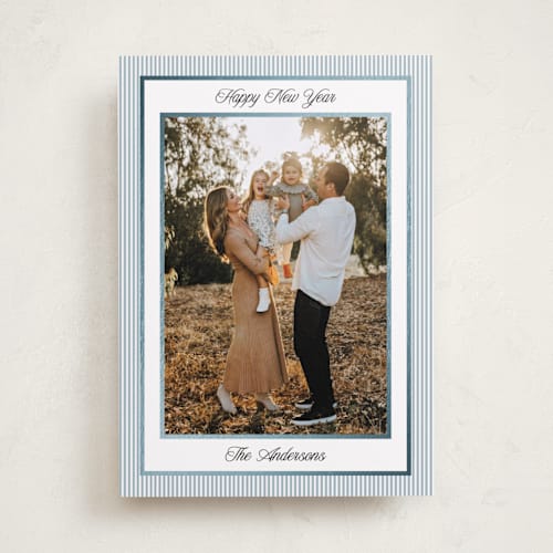 This is a pool foil pressed holiday cards with foil pressed by Annie Shapiro called little stripes printing on recycled smooth signature in standard