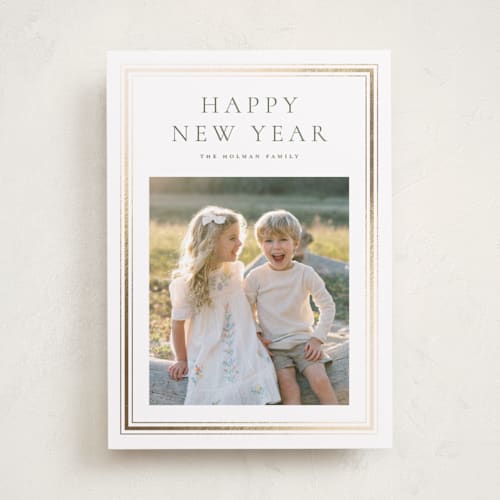 This is a pine foil pressed holiday cards with foil pressed by Wildfield Paper Co called eucalyptus printing on recycled smooth signature in standard