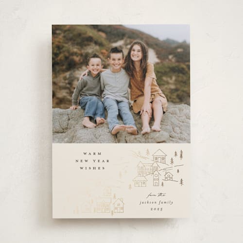 This is a latte foil pressed holiday cards with foil pressed by Carolyn Nicks called wintry town printing on recycled smooth signature in standard