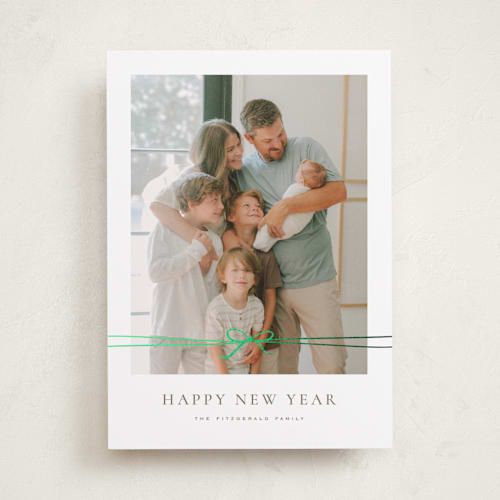 This is a cedar foil pressed holiday cards with foil pressed by Wildfield Paper Co called delicate ribbon printing on recycled smooth signature in standard