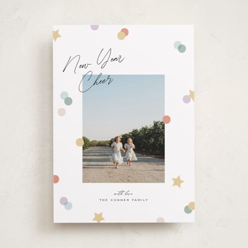 This is a confetti new year photo cards with standard by Pixel and Hank called confetti cheers printing on recycled smooth signature in standard