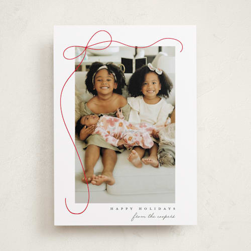 This is a snow holiday photo cards with standard by Lauren Chism called cascading bow printing on recycled smooth signature in standard
