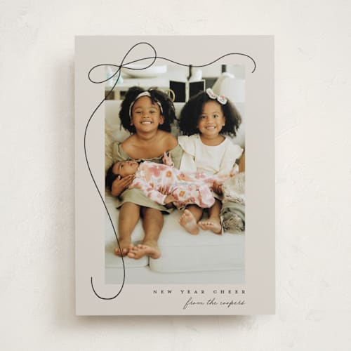 This is a putty holiday photo cards with standard by Lauren Chism called cascading bow printing on recycled smooth signature in standard