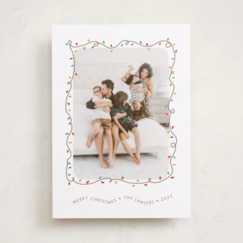 This is a frosting holiday photo cards with standard by Holly Whitcomb called crazy lights printing on recycled smooth signature in standard