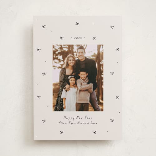 This is a vanilla holiday photo cards with standard by Lea Delaveris called little bows printing on recycled smooth signature in standard