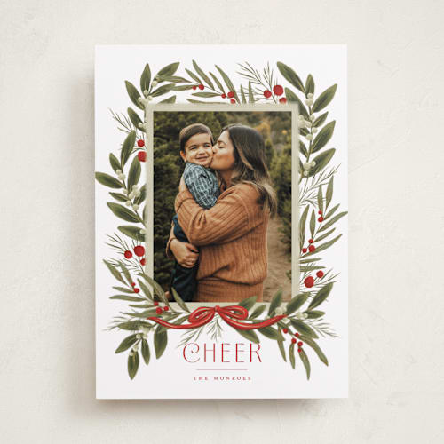 This is a poinsettia holiday photo cards with standard by Wildfield Paper Co called snowberry wreath printing on recycled smooth signature in standard