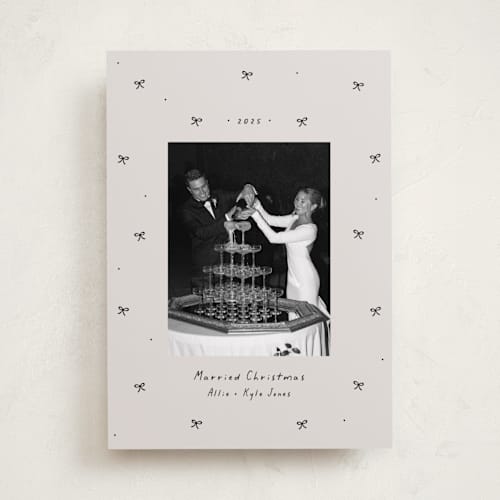 This is a vanilla holiday photo cards with standard by Lea Delaveris called little bows printing on recycled smooth signature in standard