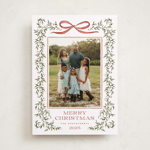 This is a holly berry holiday photo cards with standard by Wildfield Paper Co called laurel wreath printing on recycled smooth signature in standard