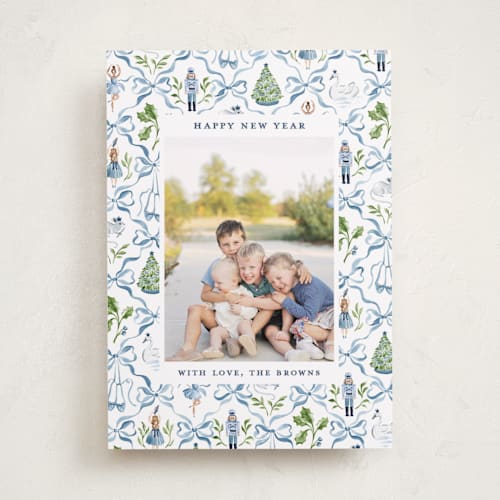 This is a blue ribbon holiday photo cards with standard by Sarah Knight called nutcracker ribbons printing on recycled smooth signature in standard