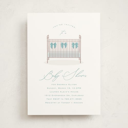 This is a powder blue baby shower invitations with standard by Carolyn MacLaren called crib bows printing on signature in standard