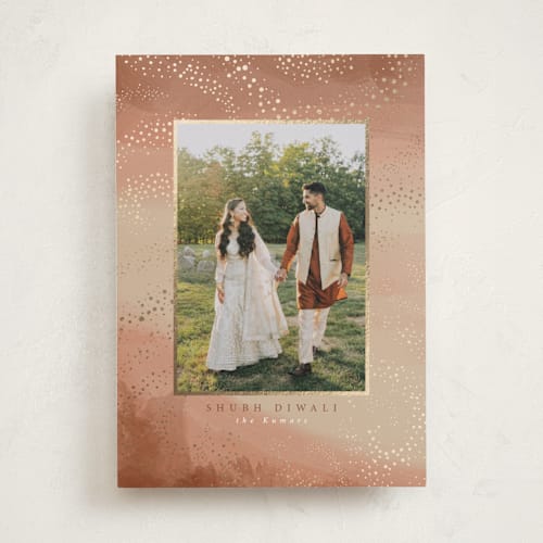 This is a almond diwali cards with foil pressed by Tamara Hilje called diya trails printing on signature in standard