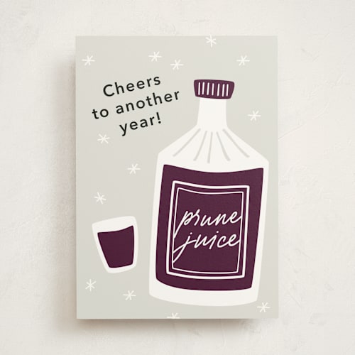 This is a prune tbd with standard by Carrie Moradi called shots of prune juice printing on signature in greeting cards