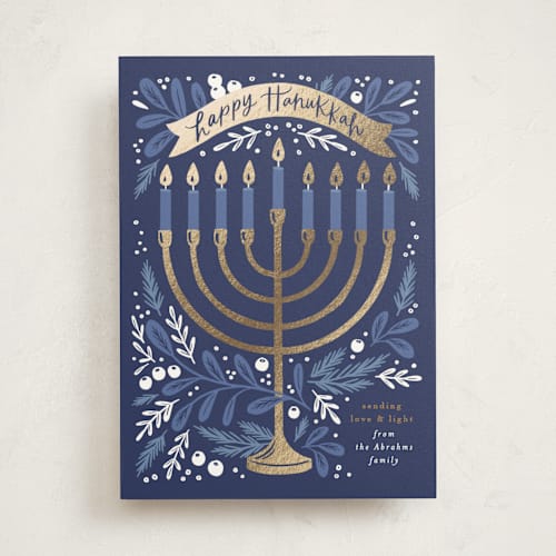 This is a navy hanukkah cards with foil pressed by Alethea and Ruth called hanukkah greenery printing on signature in standard