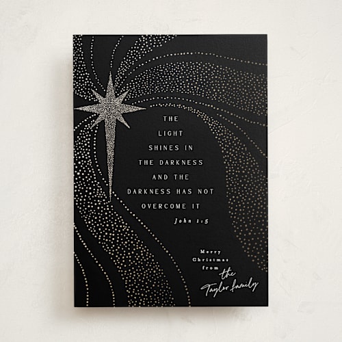 This is a midnight foil pressed holiday cards with foil pressed by Alethea and Ruth called a light shines printing on signature in standard