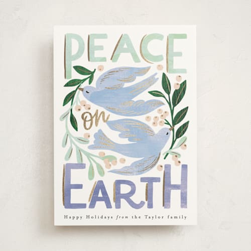 This is a periwinkle foil pressed holiday cards with foil pressed by Alethea and Ruth called peace on earth birds printing on signature in standard