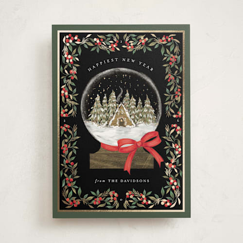 This is a coal foil pressed holiday cards with foil pressed by Jackie Crawford called cabin snow globe printing on signature in standard
