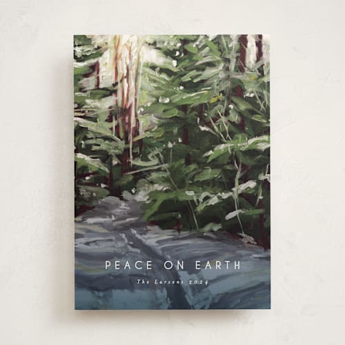 This is a pine non photo holiday cards with standard by Holly Whitcomb called peaceful forest printing on signature in standard